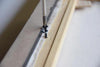 Eye screws and screws are included for fastening the canvas securely to the frame